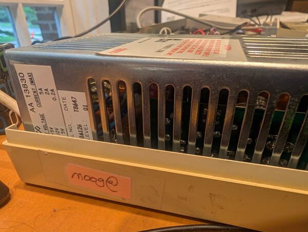 The power supply of my BBC Master, with a handwritten moog@ label still stuck to the case